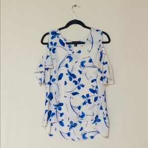 woman’s floral open shoulder top